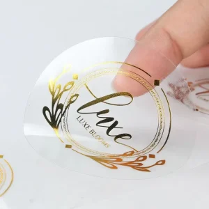 Custom Waterproof Self Adhesive Clear Gold Foil Stamping Logo Sticker Printing Transparent Label Sticker